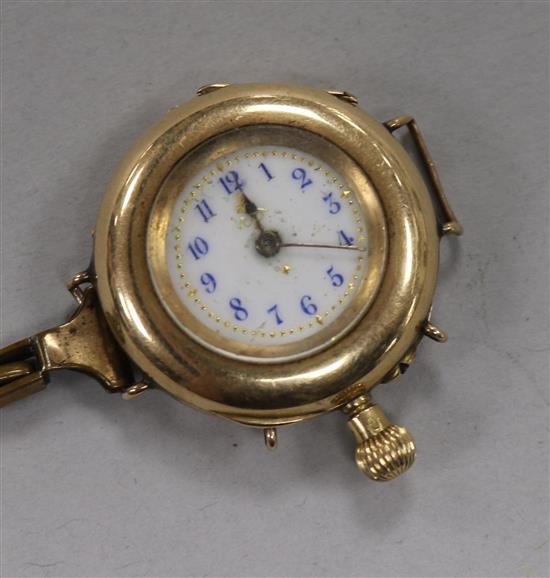 A 14ct gold wrist watch, (converted fob watch?).